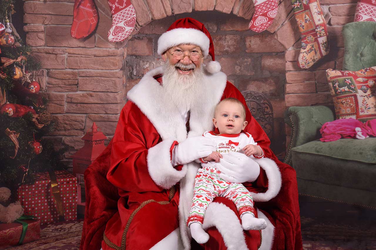 Santa Claus takes pictures with children at the annual Santa Claus visit.